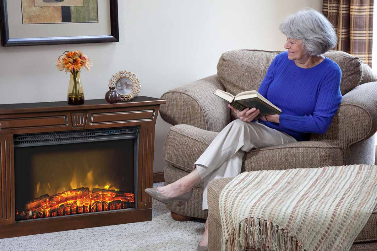 Woman enjoying an Amish Fireplace next to the couch