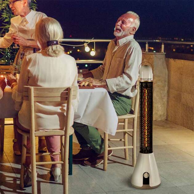 An outdoor patio dinner party with a Multi-Max Gold warming the area