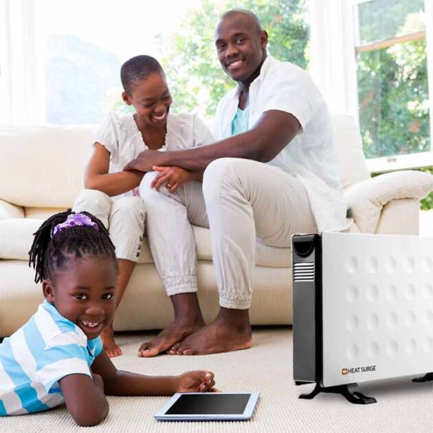 Child reading a tablet on the floor near a Power Panel with parents in the background