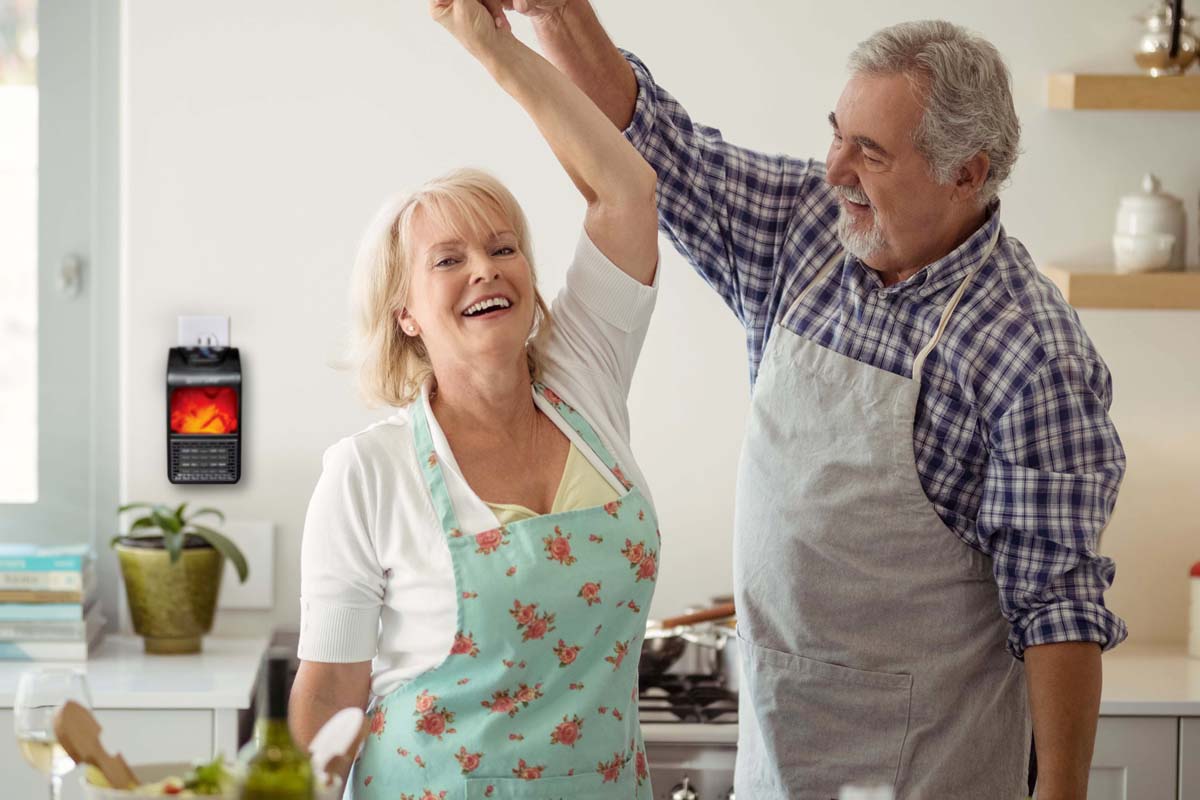 A couple dancing in the kitchen with a MiniMax plugged in behind them